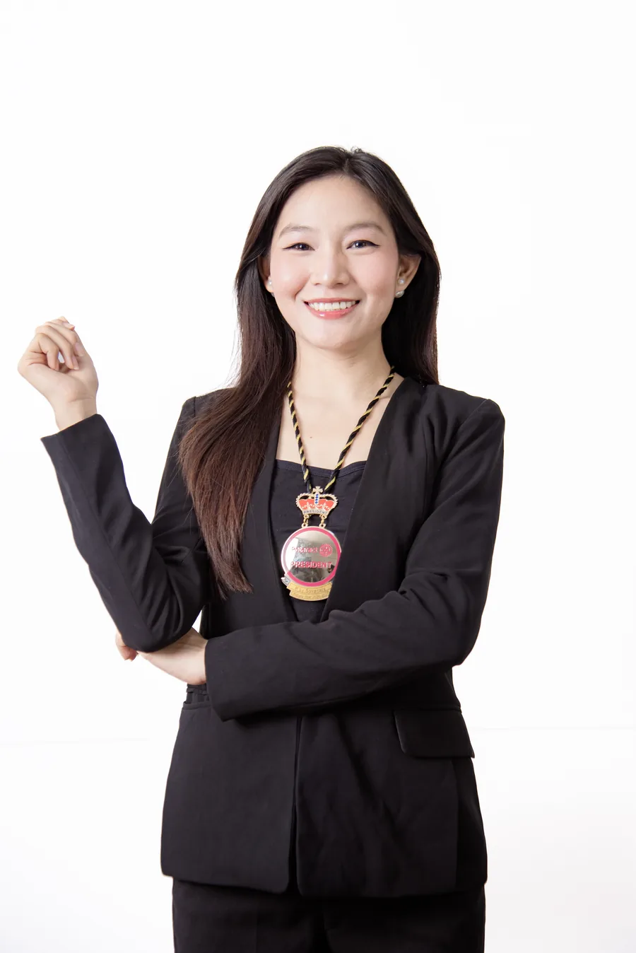 Sovanary, smiling, in a black blazer